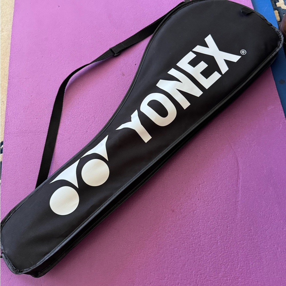 Two Yonex Black/yellow and black/orange Rackets with a original Bag